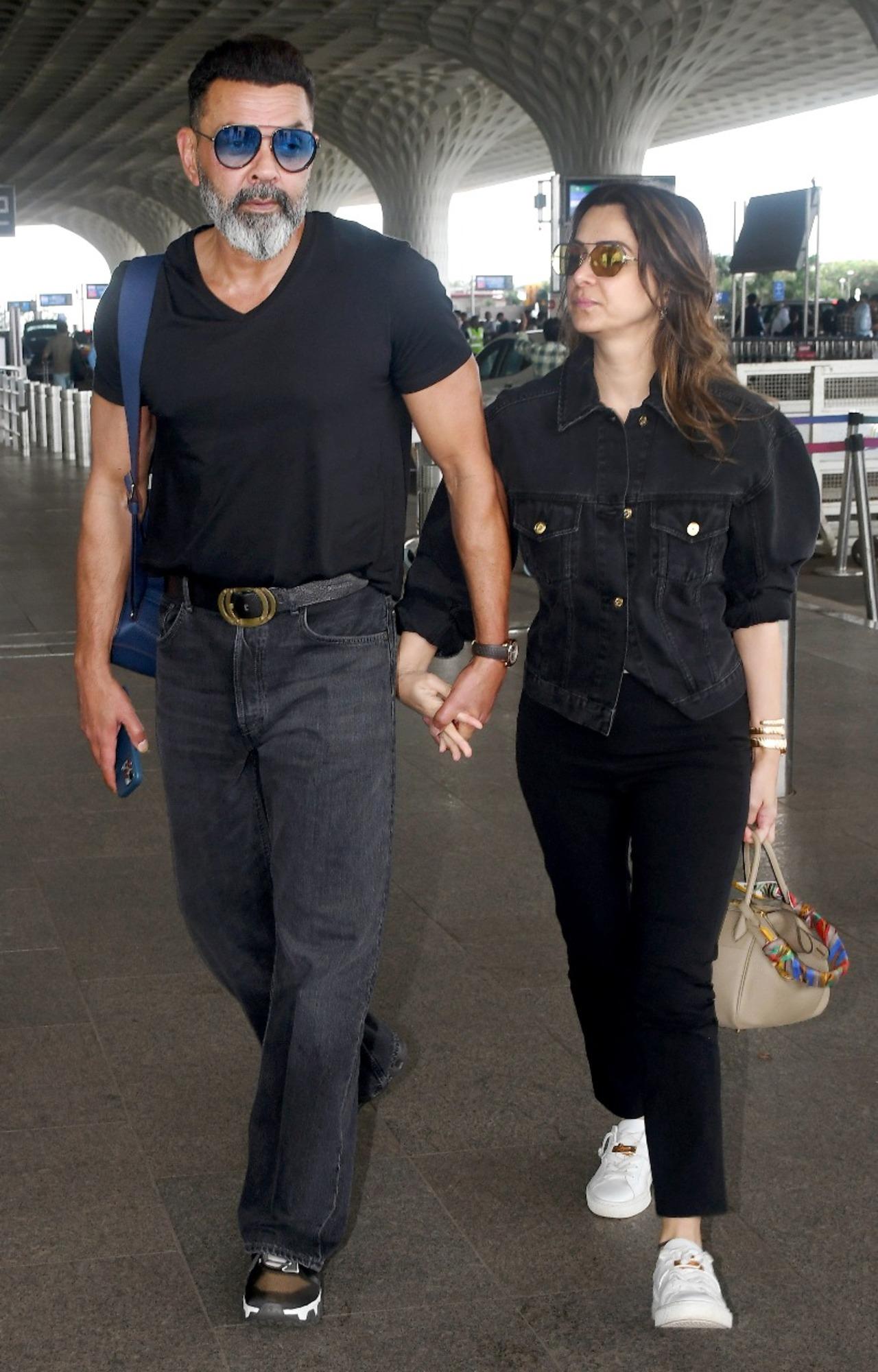 Bobby Deol, who is currently garnering praise for his performance in the newly released web series, The B***ds Of Bollywood, was spotted at Mumbai airport with his wife, Tanya Deol. The two were seen walking hand-in-hand and twinning in black. 